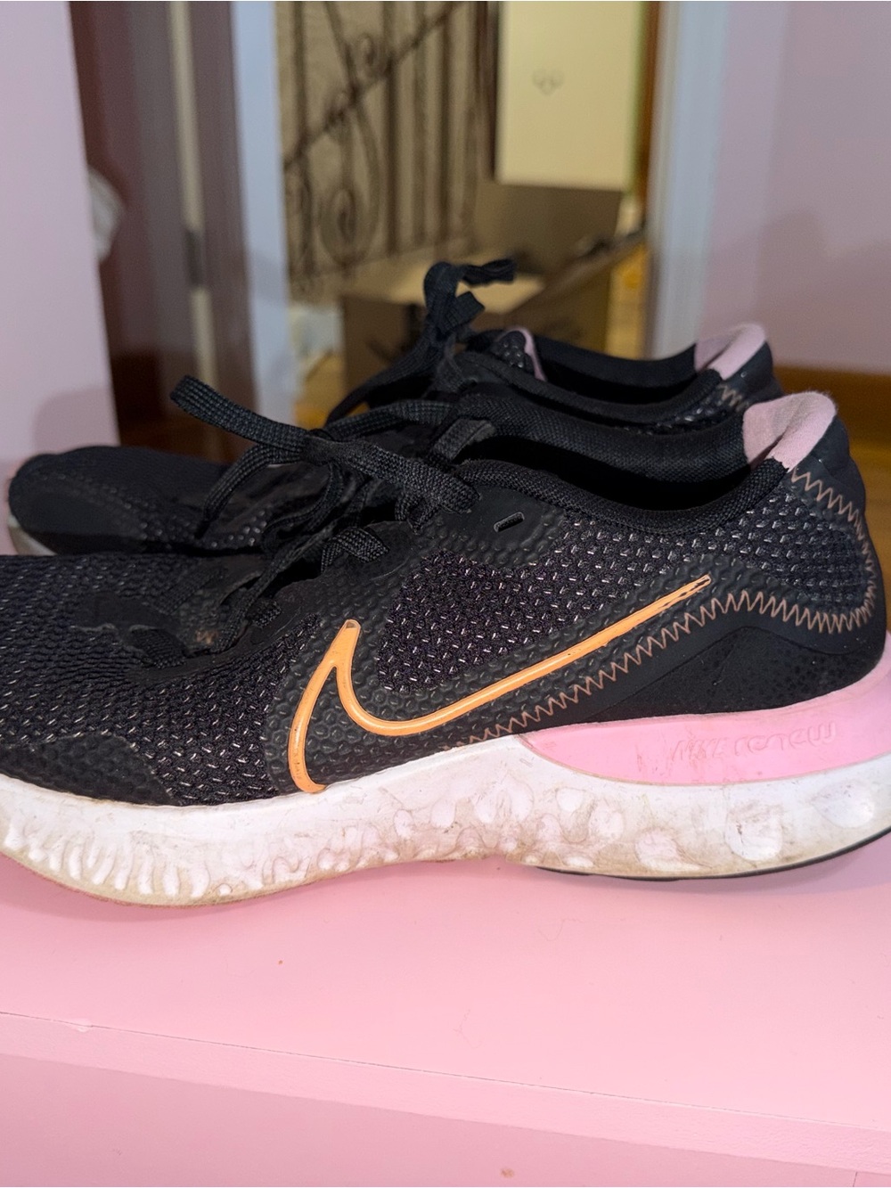 Nike Women’s Black Athletic Shoes with Pink and Orange Accents